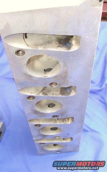 Aluminum engine cylinder head with multiple intake and exhaust ports