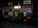 1992 Ford Mustang - A group of people stand with a red 1994 Ford Mustang at a racing event.