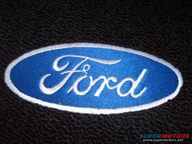 Blue oval Ford logo patch on black fabric