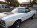 1973 Ford Ranchero - White 1973 Ford Ranchero with black hood accent and chrome wheels.