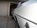 1973 Ford Ranchero - White 1973 Ford Ranchero parked in front of a garage door.