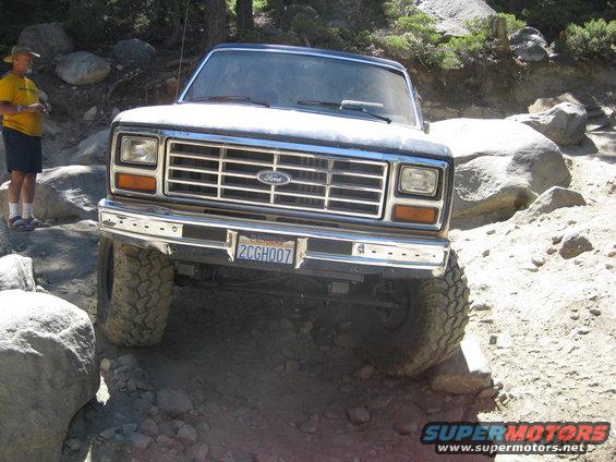 1986 Ford Bronco front view on rocky trail. California license plate 2CGH007