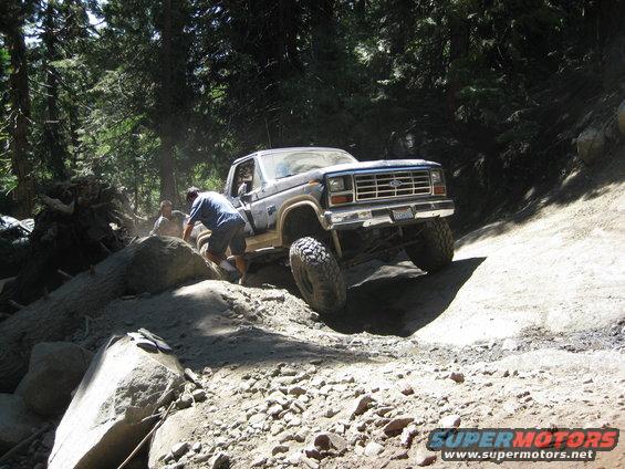 1986 Ford Bronco navigating rocky terrain