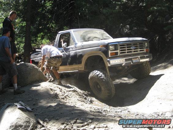 Ford F-Series truck going off-road, people watching