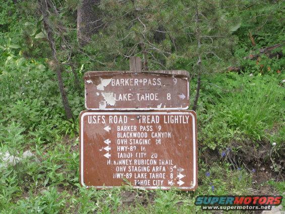 Trail signs for Barker Pass and Lake Tahoe