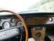 1968 Mercury Cougar - The interior of a 1968 Mercury Cougar shows a woodgrain dashboard with multiple gauges and a classic steering wheel.