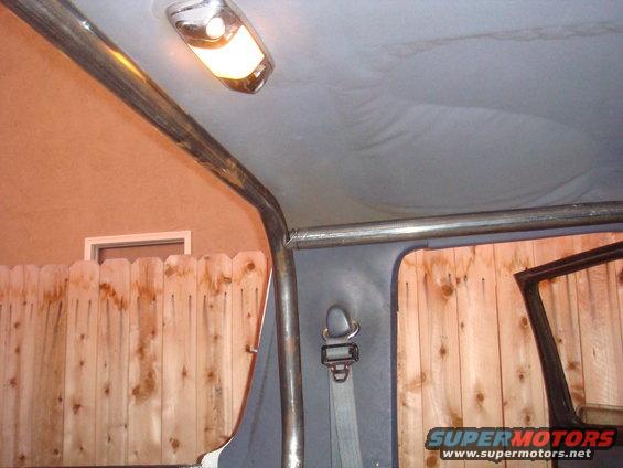 Interior roll cage and seatbelt