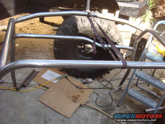 Roll cage tubing and large off-road tire