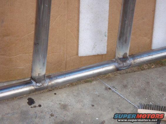 Close-up of welded metal tubing, possibly part of a roll cage or bumper