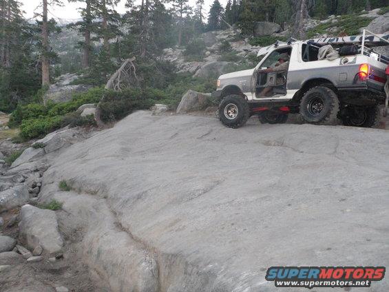 1991 Ford Bronco climbing a rocky trail