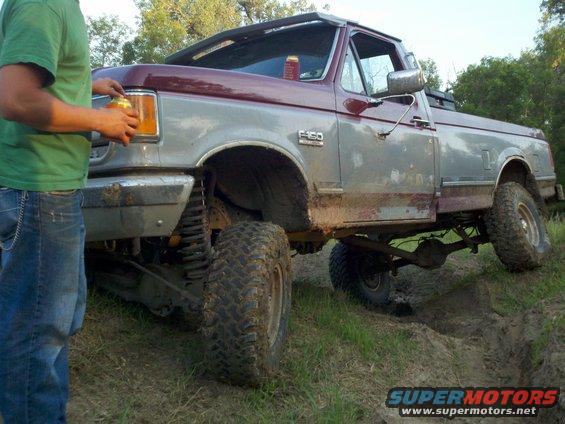 Ford F-150 pickup truck with lifted suspension, off-roading