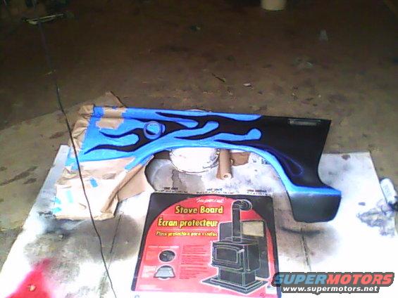 Fender with blue and black flame graphics