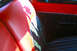 1959 Ford Ranchero - Interior view of a 1959 Ford Ranchero, red and black upholstery and a door panel.