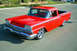 1959 Ford Ranchero - This 1959 Ford Ranchero features a bright red exterior, chrome accents, and custom wheels, presented in a 3/4 front view.
