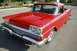 1959 Ford Ranchero - This 1959 Ford Ranchero features a distinctive grille and bright red paint.