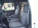1978 Ford Bronco - Interior view of a 1978 Ford Bronco, with a second vehicle seen through the side window.
