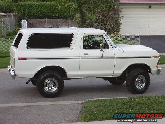 White 1978 Ford Bronco parked on a suburban street, side view
