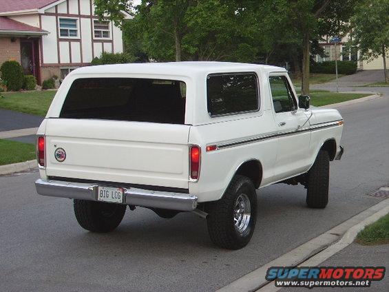 1978 Ford Bronco rear view, parked on street with house in background