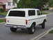 1978 Ford Bronco - Rear view of a white 1978 Ford Bronco parked on a residential street.