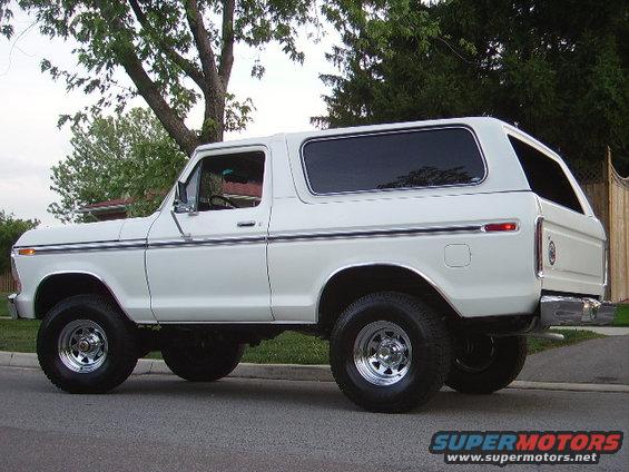 White 1978 Ford Bronco parked on a street, side view