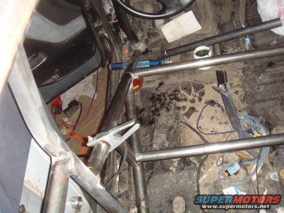 Interior view of a vehicle with a custom roll cage installed