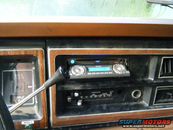 Interior view of a vehicle's dashboard showing a Sony stereo and climate controls