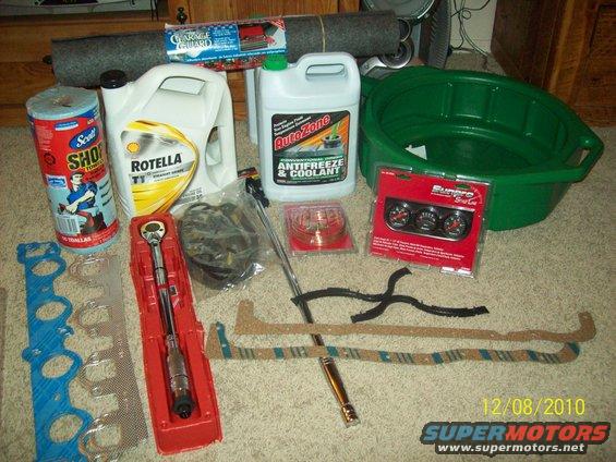 Automotive parts including oil, coolant, torque wrench, gaskets, and gauges