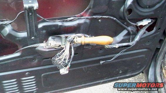 Door panel wiring harness with wooden handle tool