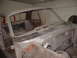 1964 Ford Fairlane - The body of a 1964 Ford Fairlane is shown in primer, stripped down for restoration.