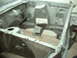 1964 Ford Fairlane - The bare engine bay of a vehicle, likely undergoing restoration or repair work.