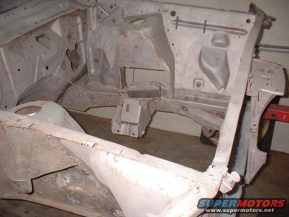 Car frame and firewall stripped down for restoration