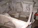 1964 Ford Fairlane - Stripped car frame and firewall, likely undergoing restoration work.