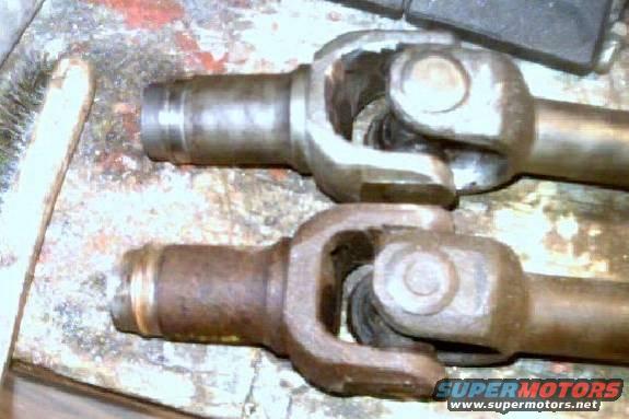 yokeclearance.jpg Without the limit cable, the suspension has enough droop to bind the center axle u-joint. Some quick work with a grinder... problem solved.