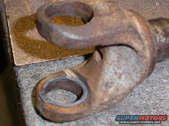 Axle yoke modified to accept a full-circle snap ring clip (prevents spitting of the clips, leading to broken parts)