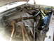 1996 Ford Bronco - Custom roll cage installed in the engine bay, obscuring some components.