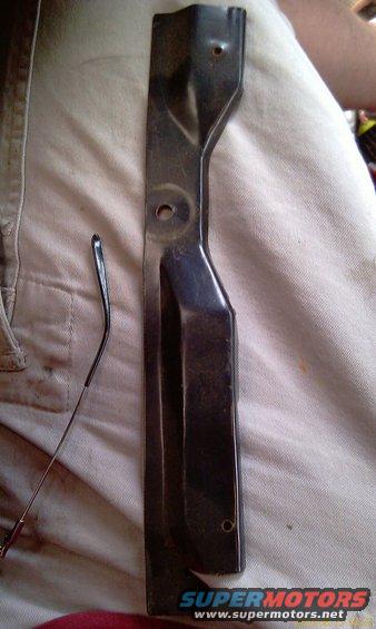 Metal bracket with two circular holes and a bent section