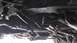 1968 Ford Ranchero - Close-up of the steering linkage components on the underside of a vehicle.