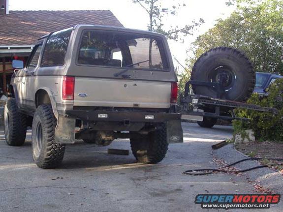 rear2.jpg Swingout open, showing Hi-Lift jack (a shovel also goes above the jack).

No gas cans yet... With the little V6 that gives low-20s MPG, having extra cans hasn't become a huge priority yet (I'm already able to go farther on the factory 23 gal tank than most of the Jeeps I'm with hauling 10 extra gallons lol).