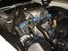 1973 Ford Ranchero - Close-up view of a V8 engine in a vehicle's engine bay.