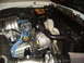 1973 Ford Ranchero - The engine bay shows various components including the battery, alternator, and cooling fan.