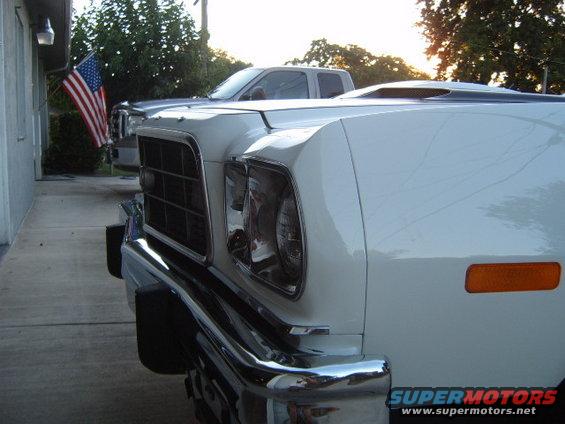 White 1973 Ford Ranchero front quarter with hood scoop and chrome bumper