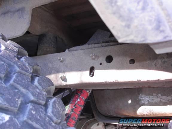 Extended rear shock mount (using space from the body lift)
P.S., that crappy Rancho shock is long gone... Have Fox 2.0s all around now.