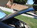 1992 Ford Taurus - The hood of a dark blue 1992 Ford Taurus is open, revealing the engine compartment and a blue cloth on the windshield.