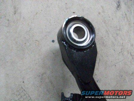 Black suspension part with a metal bushing