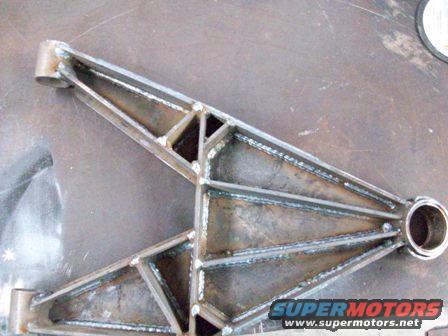 Welded steel custom control arm, raw metal finish, viewed from above