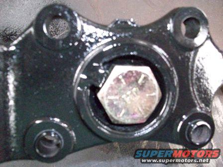 Black metal part with hex bolt