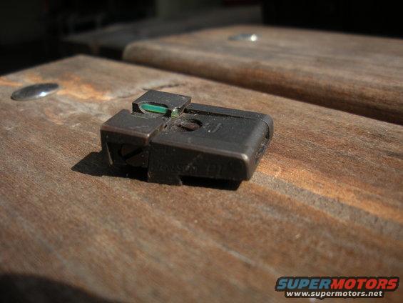gun sight on wooden surface