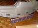 1996 Dodge 2500 - A gray dashboard section with multiple air vents is shown, resting on a stand.