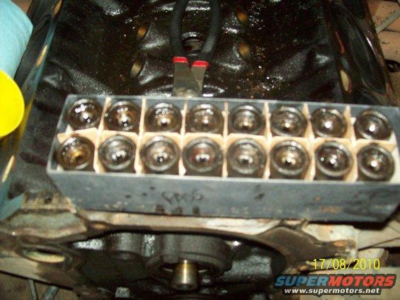 Engine block with a tray of lifters and pliers on top