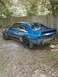 1989 Ford Mustang - This blue 1989 Ford Mustang coupe is missing its front bumper and headlights, and appears to be undergoing restoration.